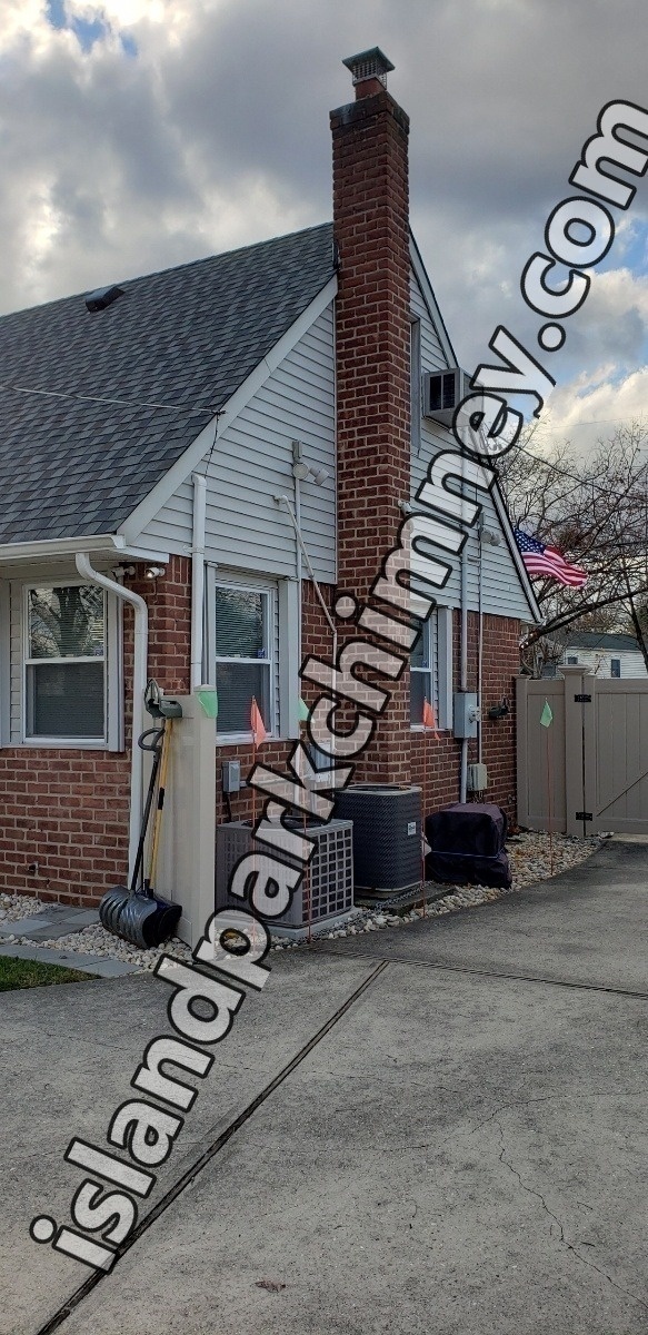Professional chimney repointing restoring brick joints in Island Park, NY